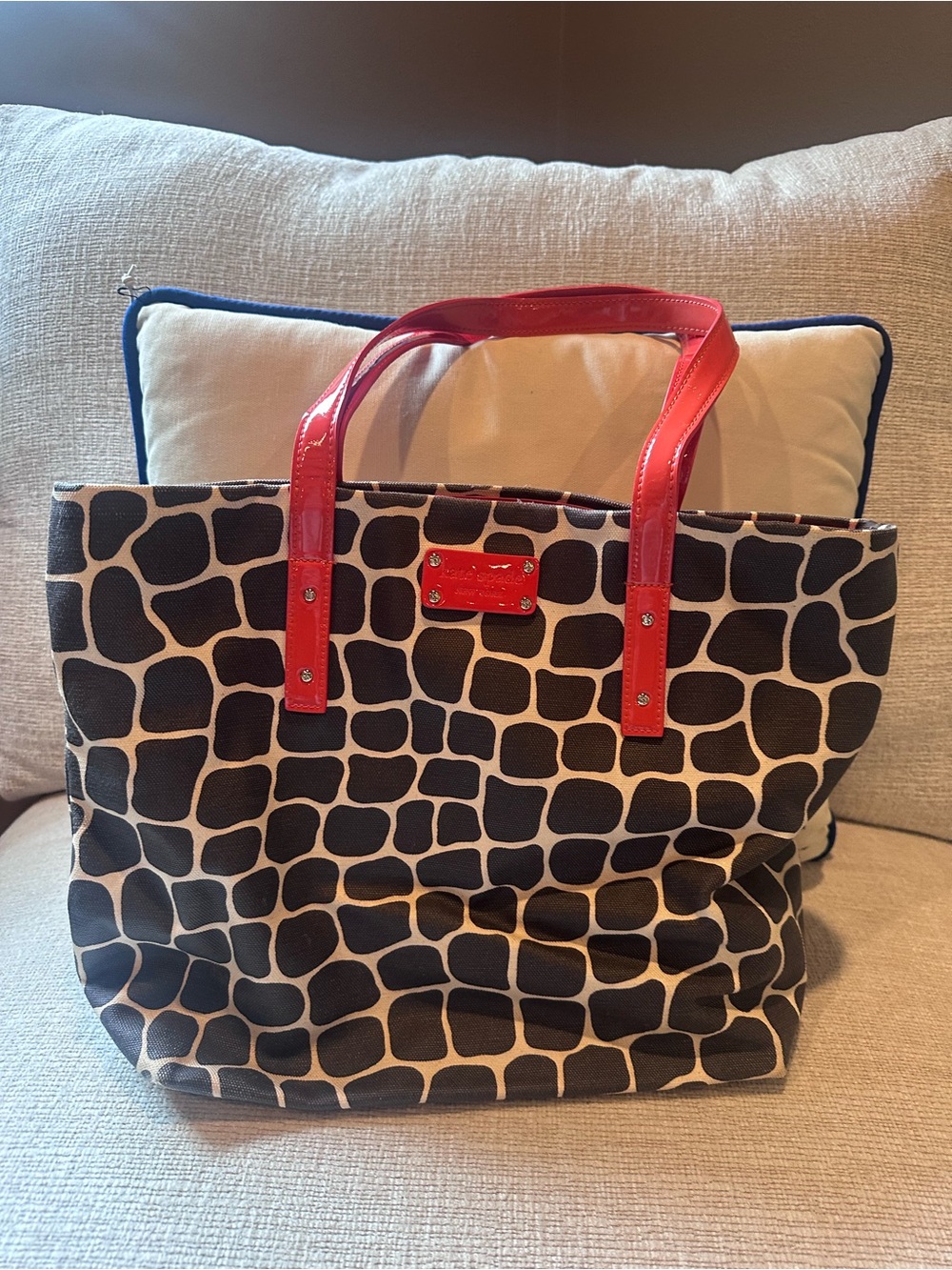 kate spade Black and Cream Giraffe-Print Tote with Orange Handles